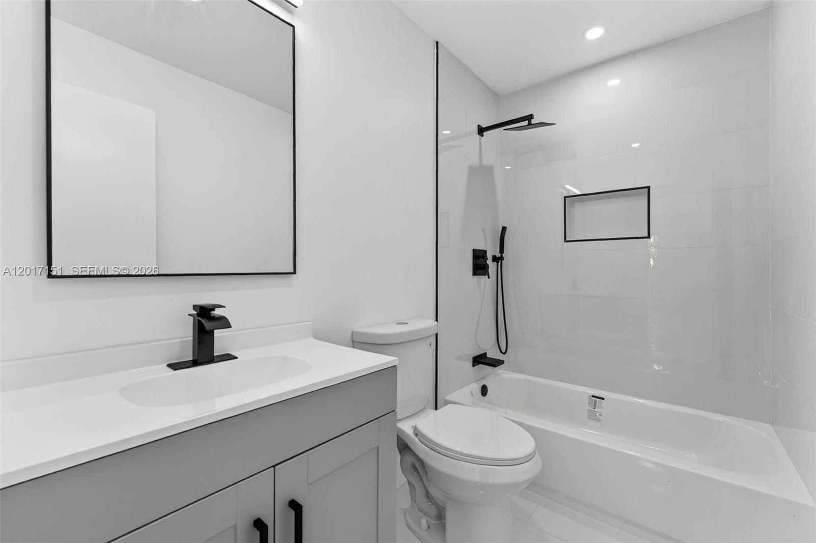 10210 Southwest 175th Street Miami, FL 33157 - Photo 8 of 25 a bathroom with a sink a toilet and shower