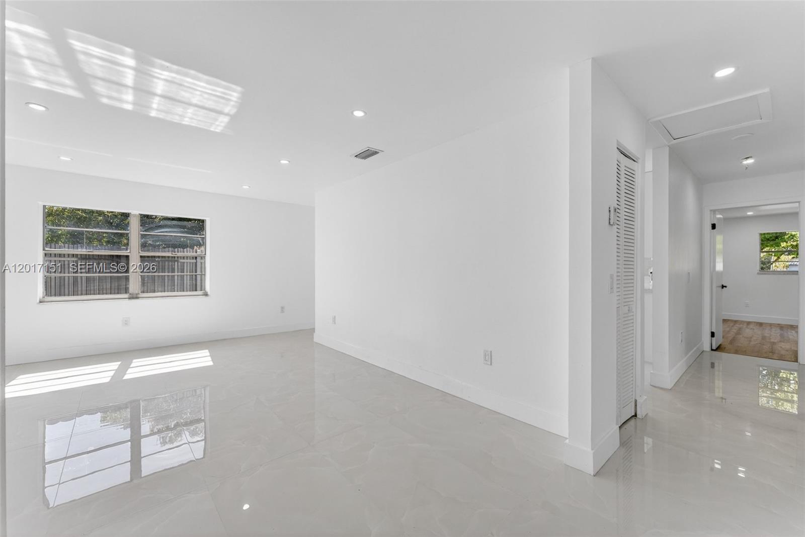 10210 Southwest 175th Street Miami, FL 33157 - Photo 10 of 25 a view of an empty room with a window