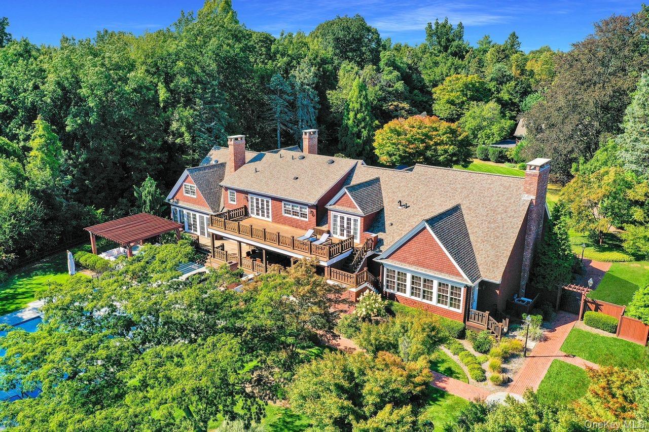 63 Dyke Road Setauket, NY 11733 - Photo 48 of 49 Aerial view of property and surrounding area featuring a heavily wooded area