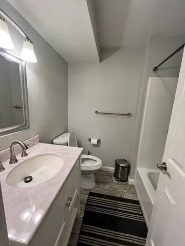 a bathroom with a sink and mirror