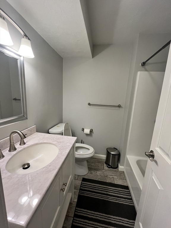 1830 Main Street, Unit 21 Tewksbury, MA 01876 - Photo 8 of 15 a bathroom with a sink and mirror