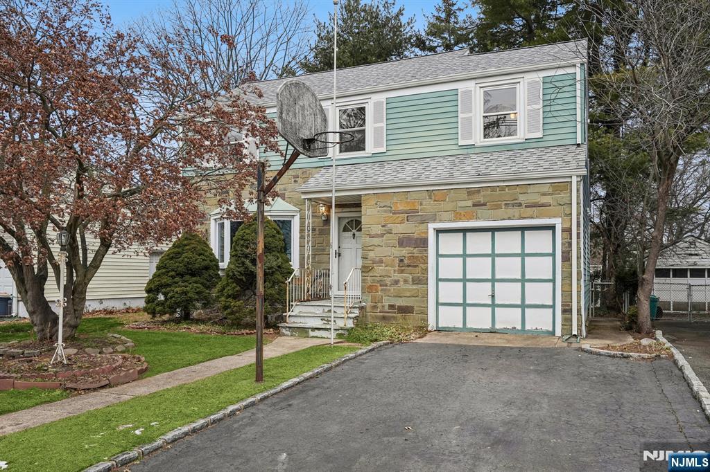 404 Burroughs Terrace Union, NJ 07083 - Photo 18 of 19 a view of a house with a yard and garage