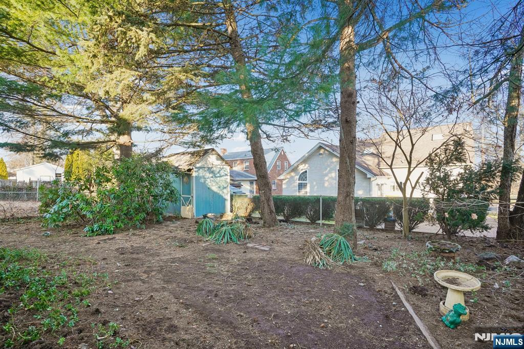 404 Burroughs Terrace Union, NJ 07083 - Photo 19 of 19 a view of a backyard with large trees