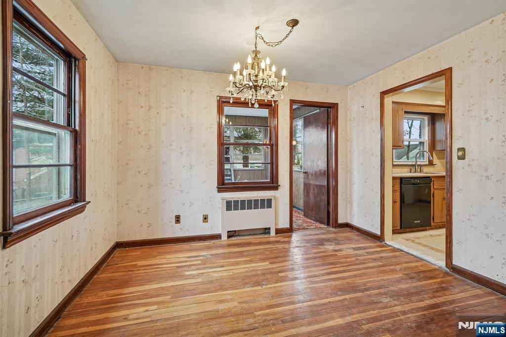 404 Burroughs Terrace Union, NJ 07083 - Photo 6 of 19 a view of an empty room with window and wooden floor