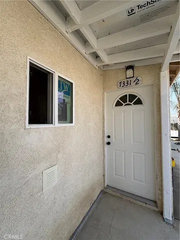a view of a hallway with entryway