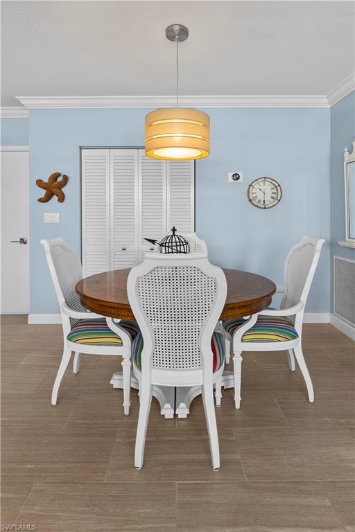 240 Seaview Court, Unit 413 Marco Island, FL 34145 - Photo 12 of 35 a dining room with furniture and window