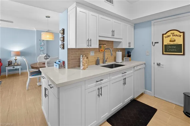a kitchen with stainless steel appliances granite countertop a sink and cabinets
