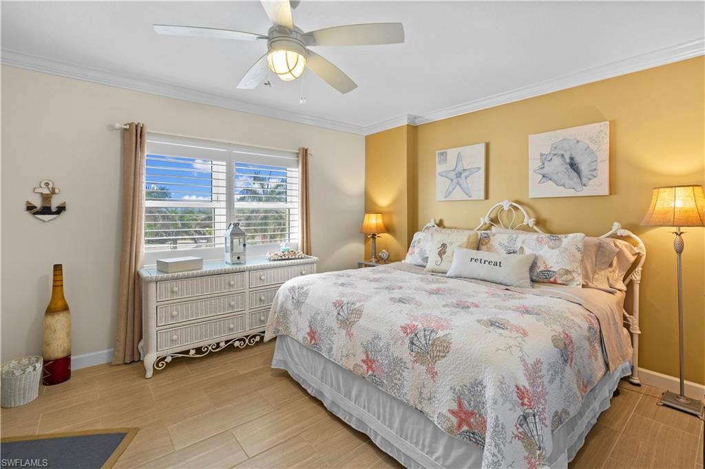 240 Seaview Court, Unit 413 Marco Island, FL 34145 - Photo 19 of 35 a bed room with a bed and a window