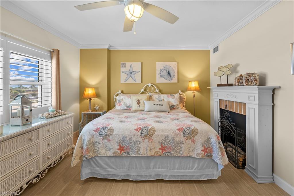 240 Seaview Court, Unit 413 Marco Island, FL 34145 - Photo 20 of 35 a spacious bedroom with a bed and a window