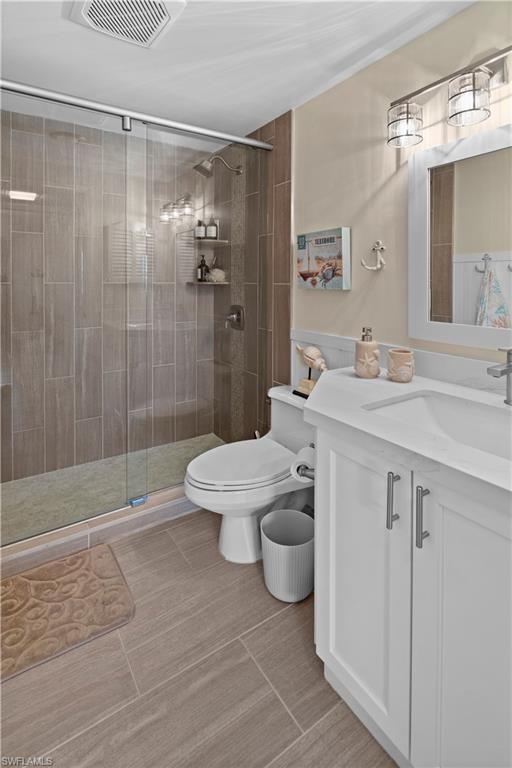 240 Seaview Court, Unit 413 Marco Island, FL 34145 - Photo 27 of 35 a bathroom with a sink a toilet and shower
