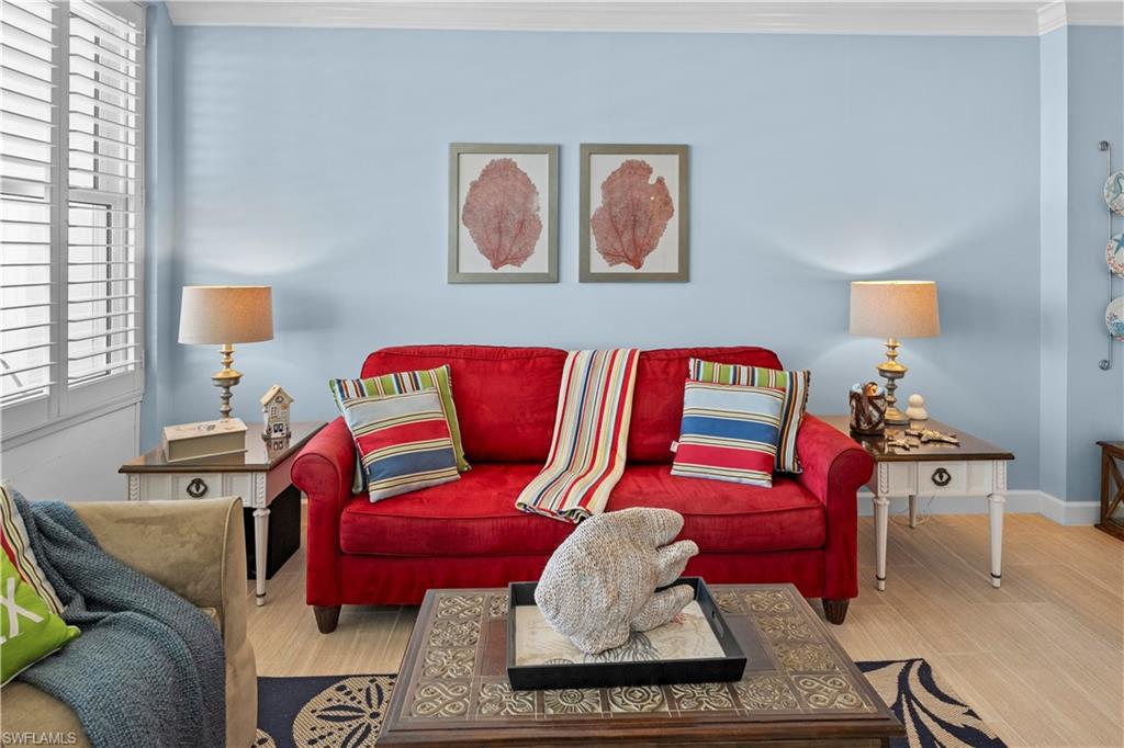 240 Seaview Court, Unit 413 Marco Island, FL 34145 - Photo 7 of 35 a living room with furniture and a couch