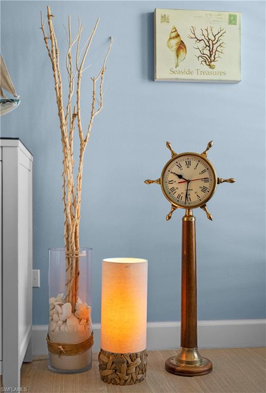 240 Seaview Court, Unit 413 Marco Island, FL 34145 - Photo 10 of 35 a room with a table and a potted plant