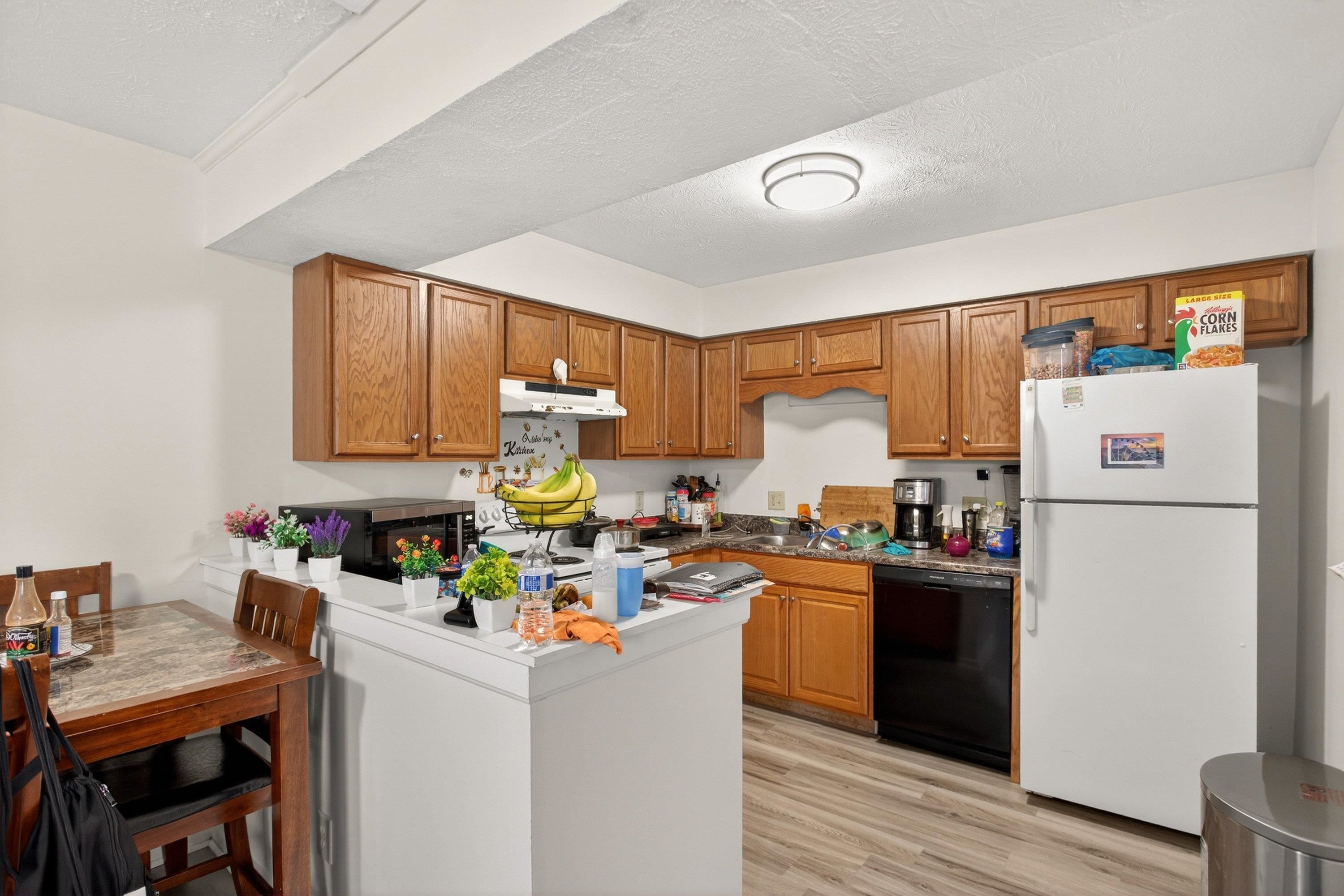 1211 Old Furnace Road Harrisonburg, VA 22802 - Photo 13 of 55 The kitchen features lots of wooden cabinetry, bonus bar area for additional counter-space, much more!