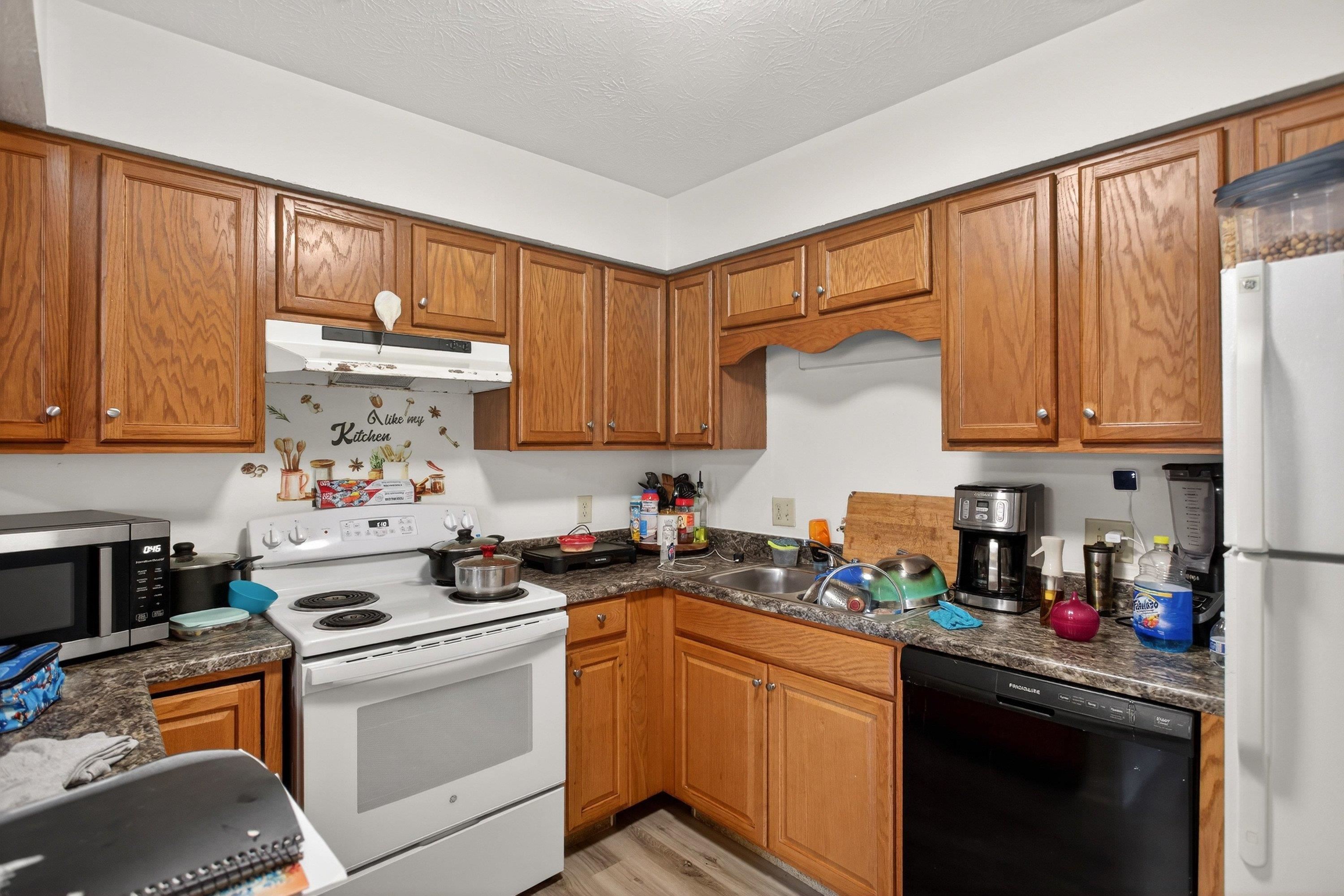 1211 Old Furnace Road Harrisonburg, VA 22802 - Photo 14 of 55 The kitchen features lots of wooden cabinetry, bonus bar area for additional counter-space, much more!