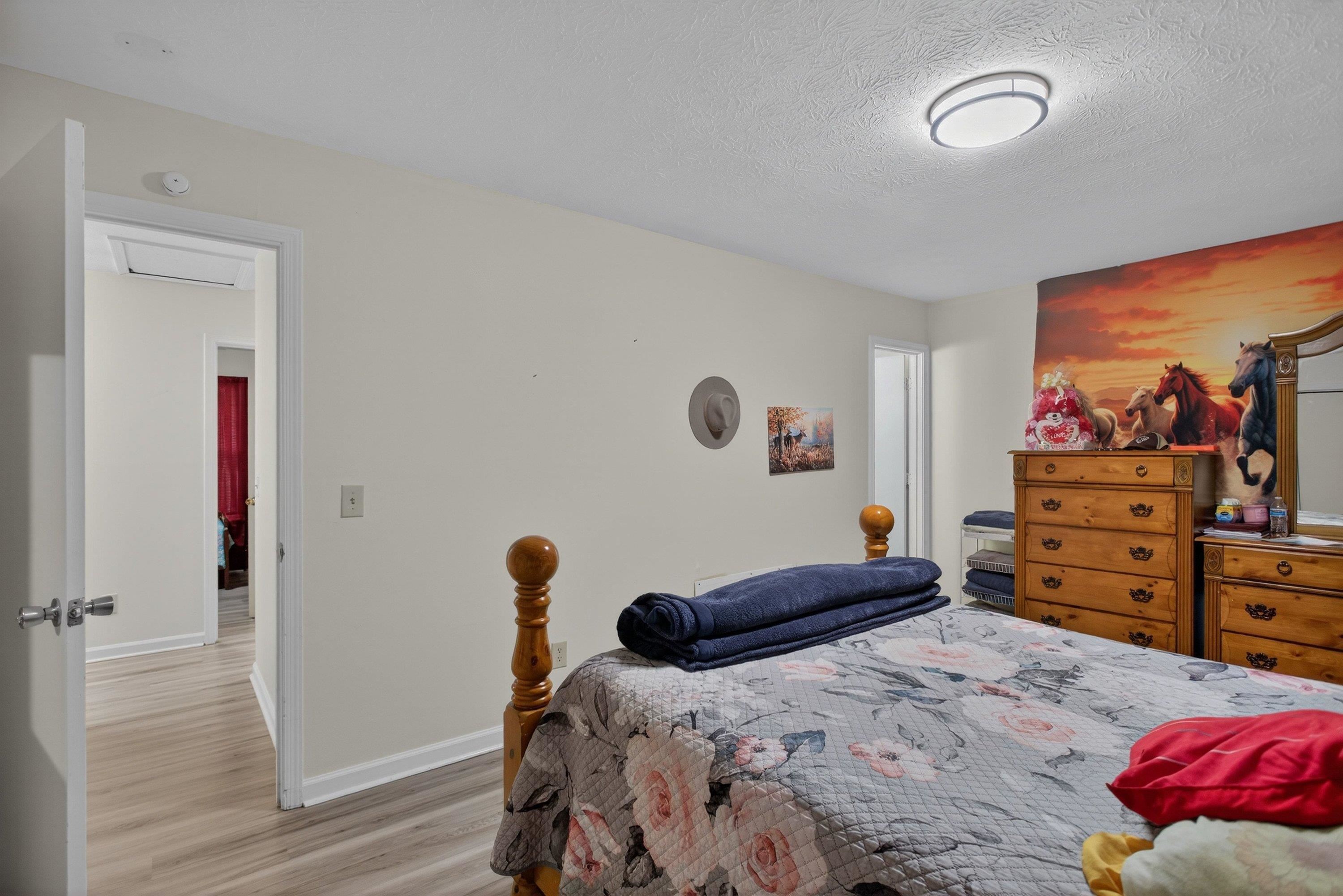 1211 Old Furnace Road Harrisonburg, VA 22802 - Photo 18 of 55 The primary bedroom offers an attached full bathroom, luxury vinyl plank flooring, large windows, spacious closet, and more!