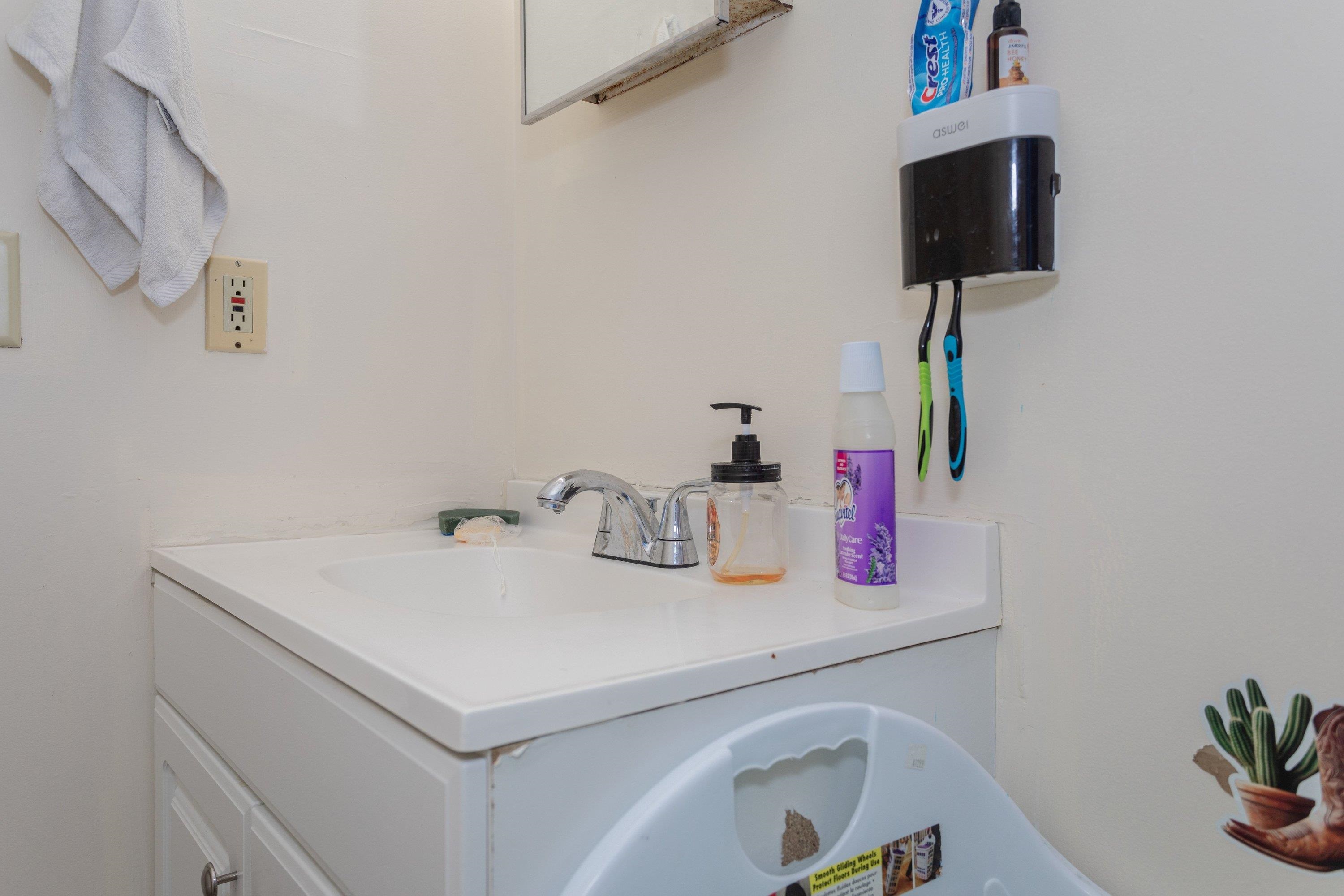 1211 Old Furnace Road Harrisonburg, VA 22802 - Photo 21 of 55 The attached primary bathroom offers a full bathtub/shower combination, vinyl flooring, and vanity with storage cabinetry.