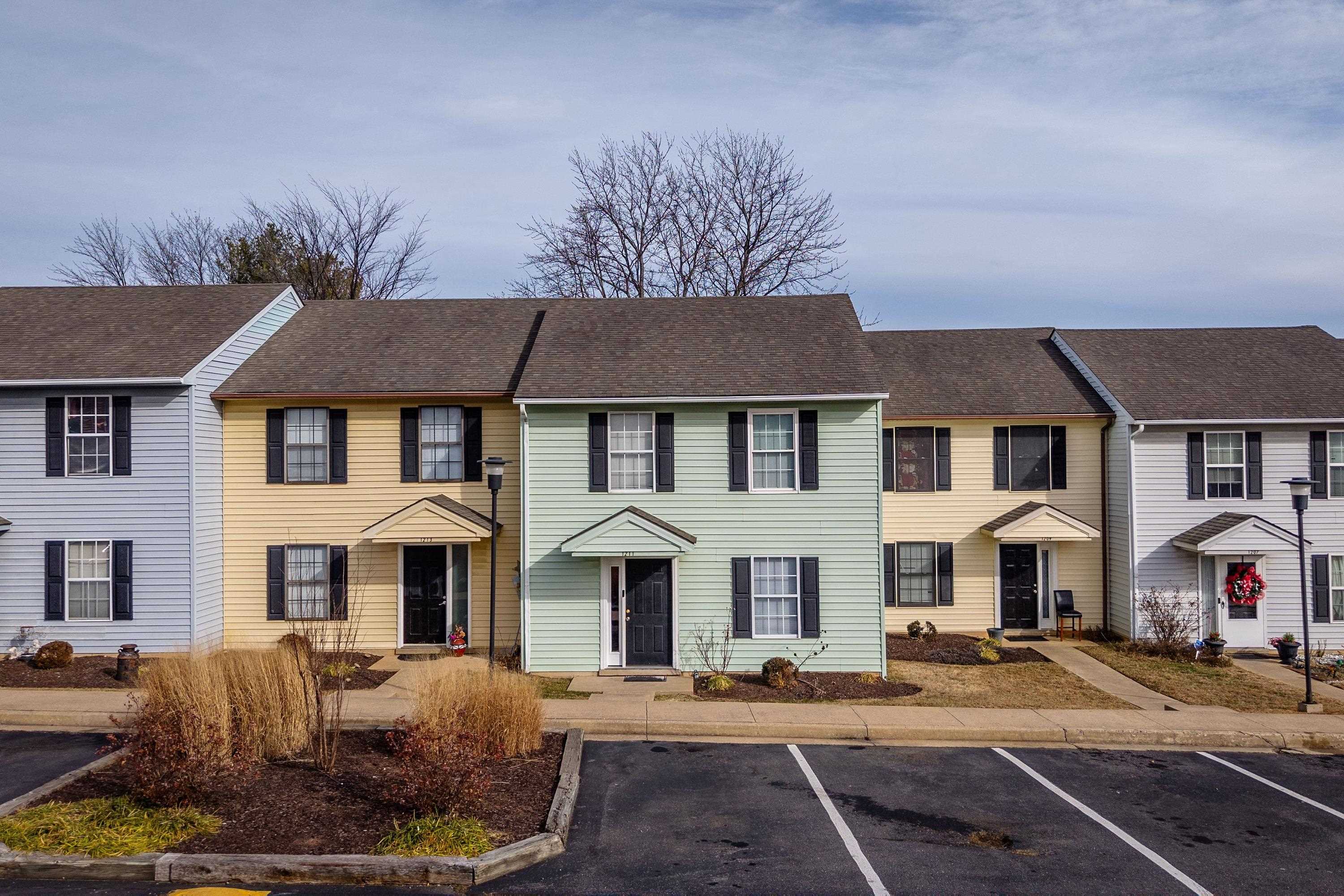 1211 Old Furnace Road Harrisonburg, VA 22802 - Photo 28 of 55 The front view of the townhouse highlights the sidewalks, multiple parking spaces, covered front porch space, and landscaping.