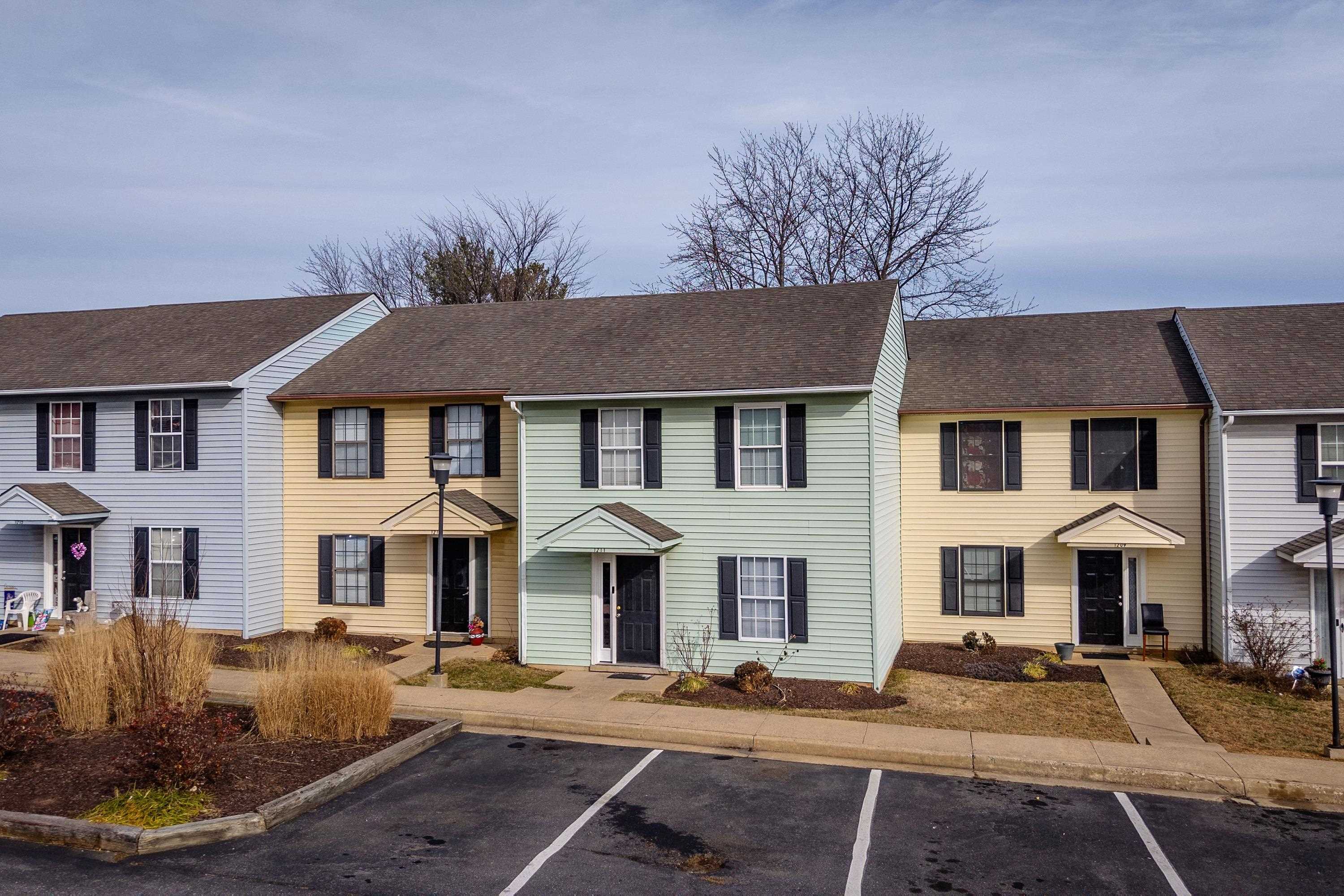 1211 Old Furnace Road Harrisonburg, VA 22802 - Photo 29 of 55 The front view of the townhouse highlights the sidewalks, multiple parking spaces, covered front porch space, and landscaping.