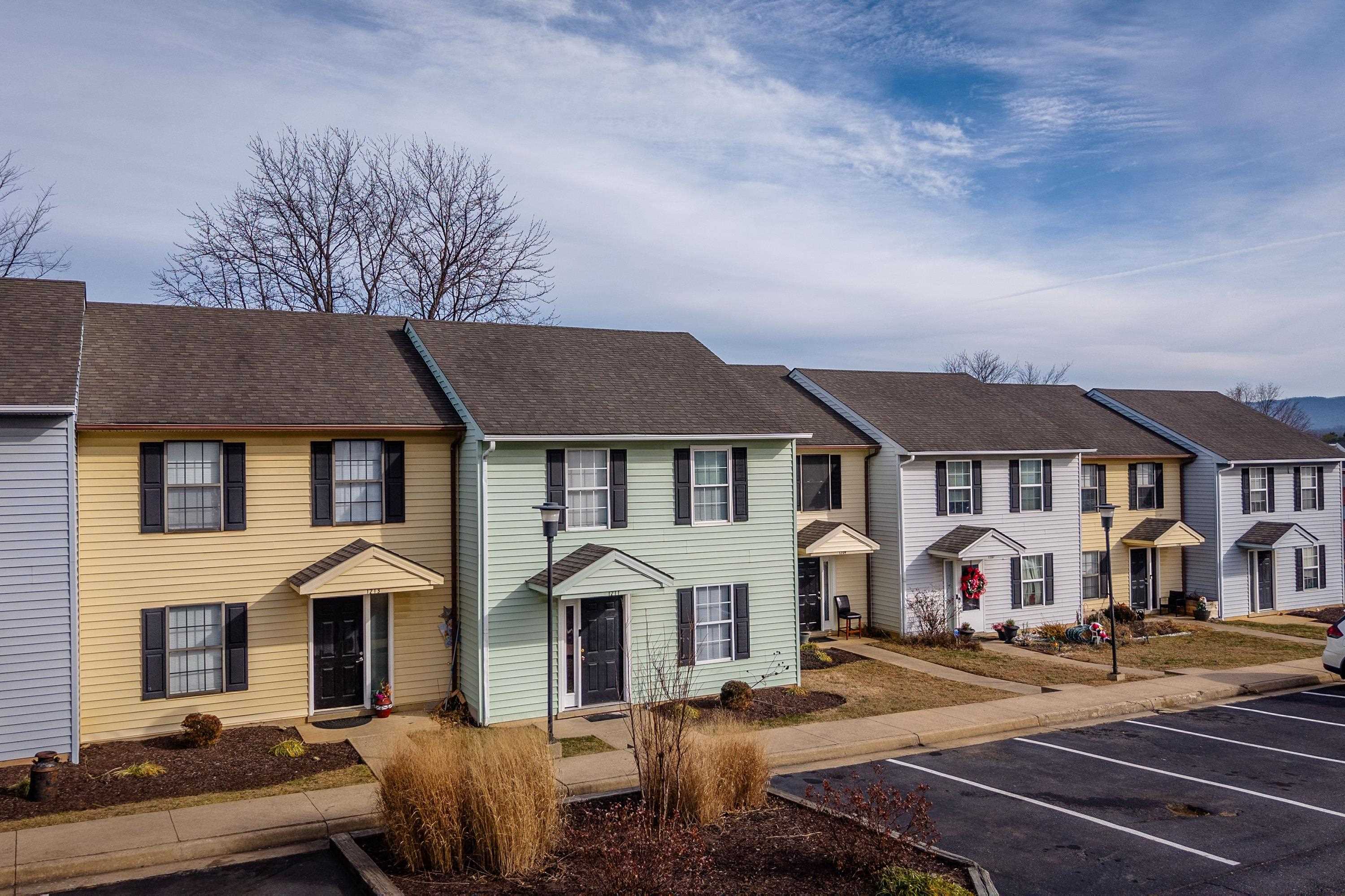 1211 Old Furnace Road Harrisonburg, VA 22802 - Photo 30 of 55 The front view of the townhouse highlights the sidewalks, multiple parking spaces, covered front porch space, and landscaping.