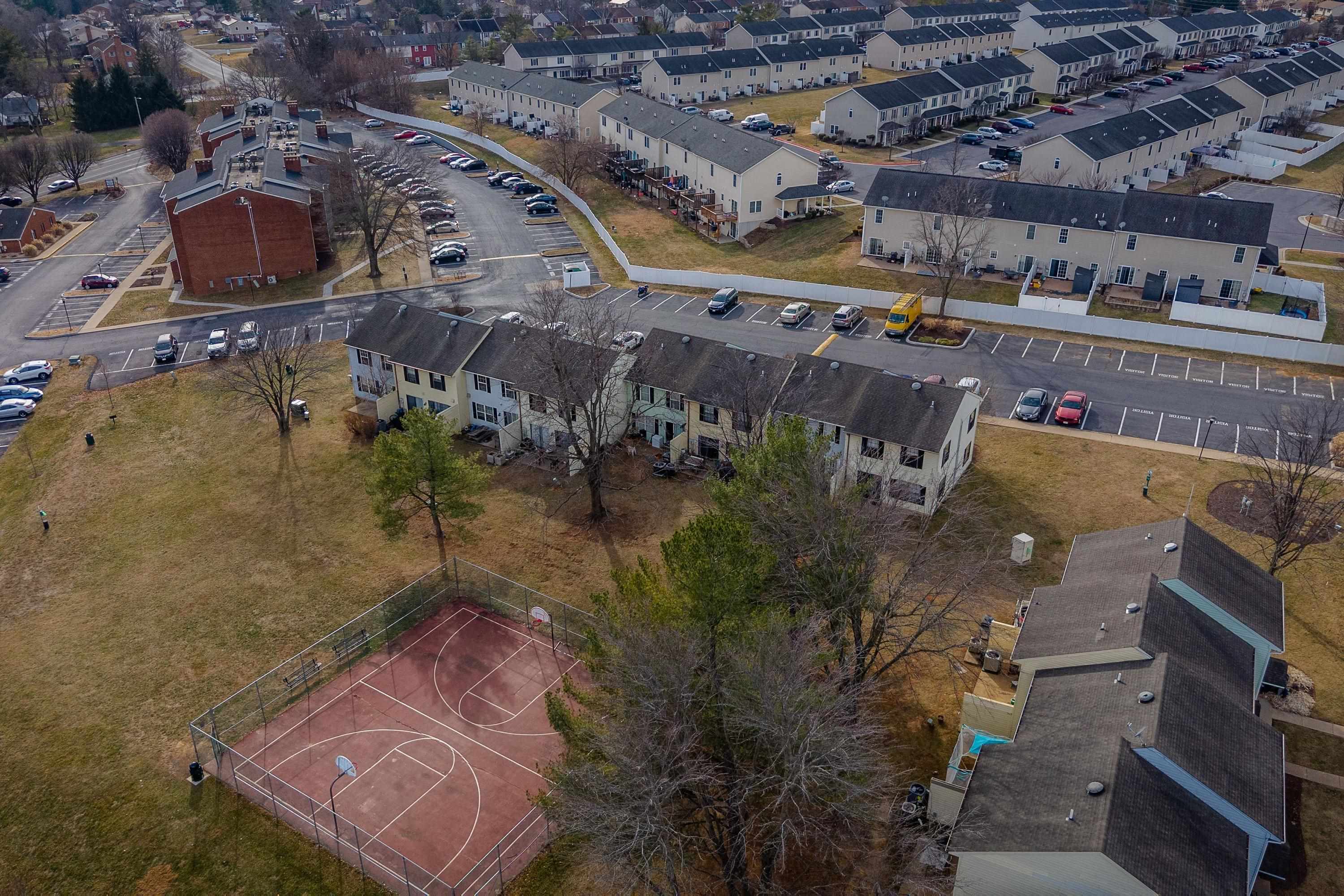 1211 Old Furnace Road Harrisonburg, VA 22802 - Photo 35 of 55 The aerial photo highlights the townhouse location within the Madison Manor neighborhood, the abundance of parking spaces, and the convenient location within the city of Harrisonburg.