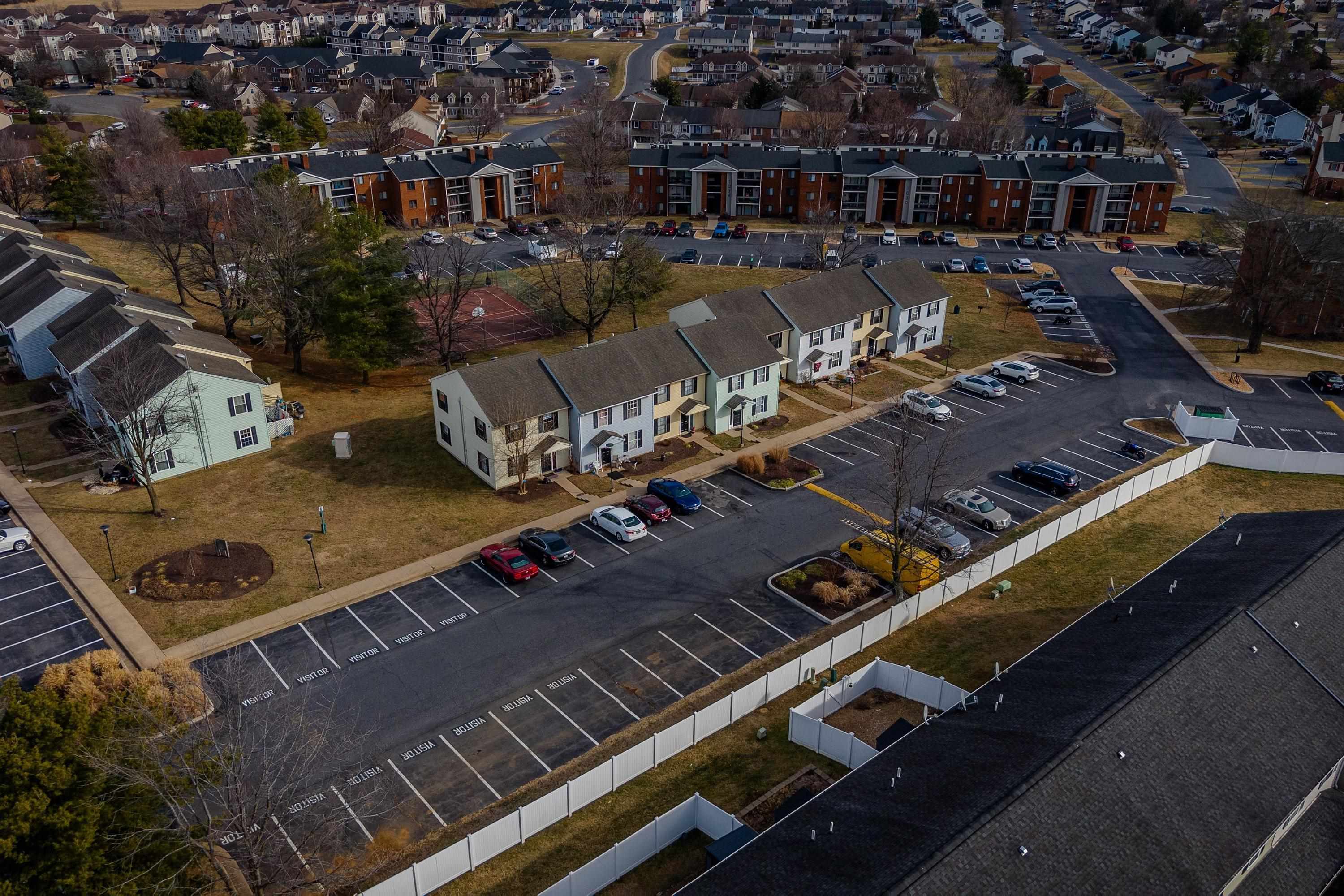 1211 Old Furnace Road Harrisonburg, VA 22802 - Photo 36 of 55 The aerial photo highlights the townhouse location within the Madison Manor neighborhood, the abundance of parking spaces, and the convenient location within the city of Harrisonburg.
