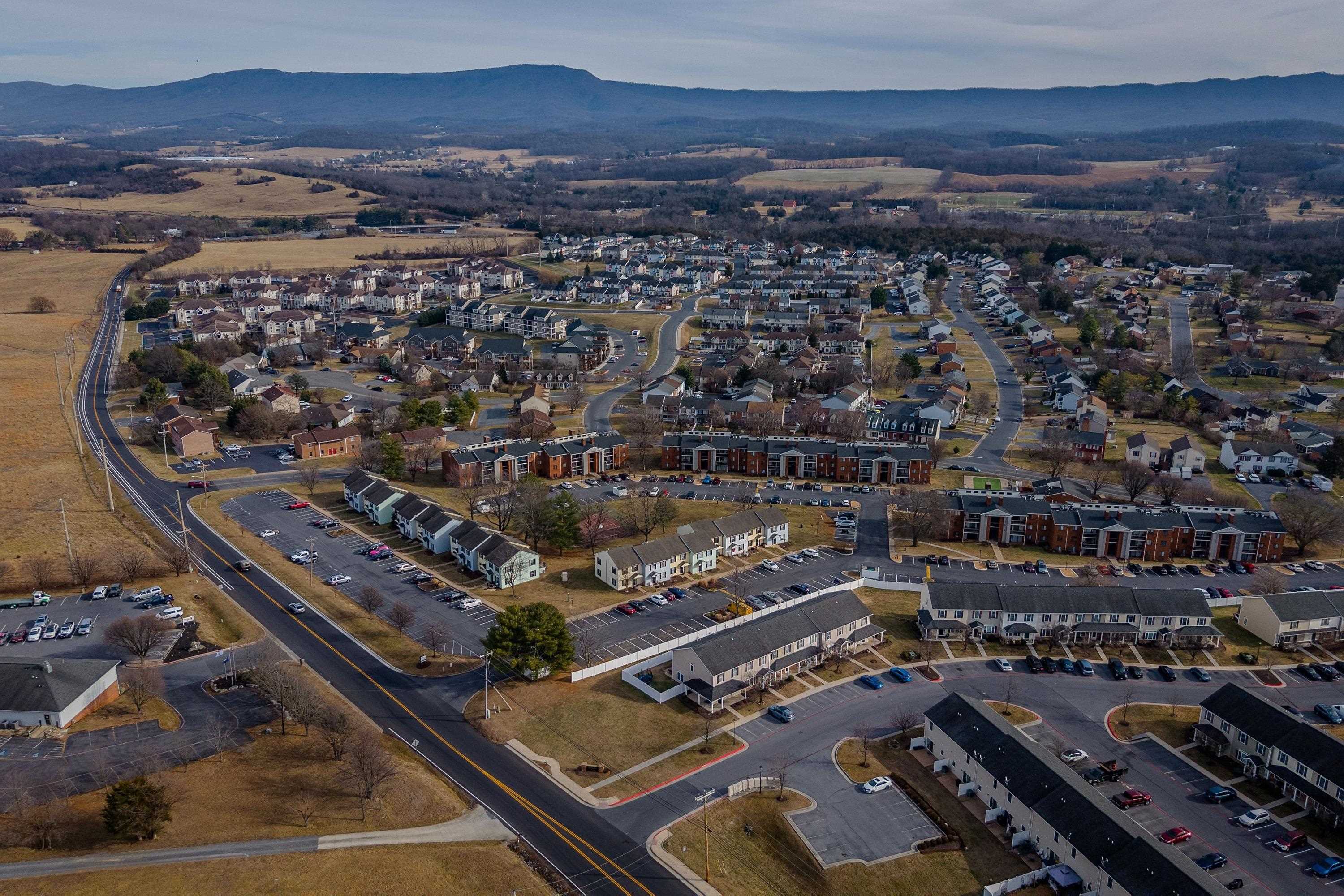1211 Old Furnace Road Harrisonburg, VA 22802 - Photo 37 of 55 The aerial photo highlights the townhouse location within the Madison Manor neighborhood, the abundance of parking spaces, and the convenient location within the city of Harrisonburg.