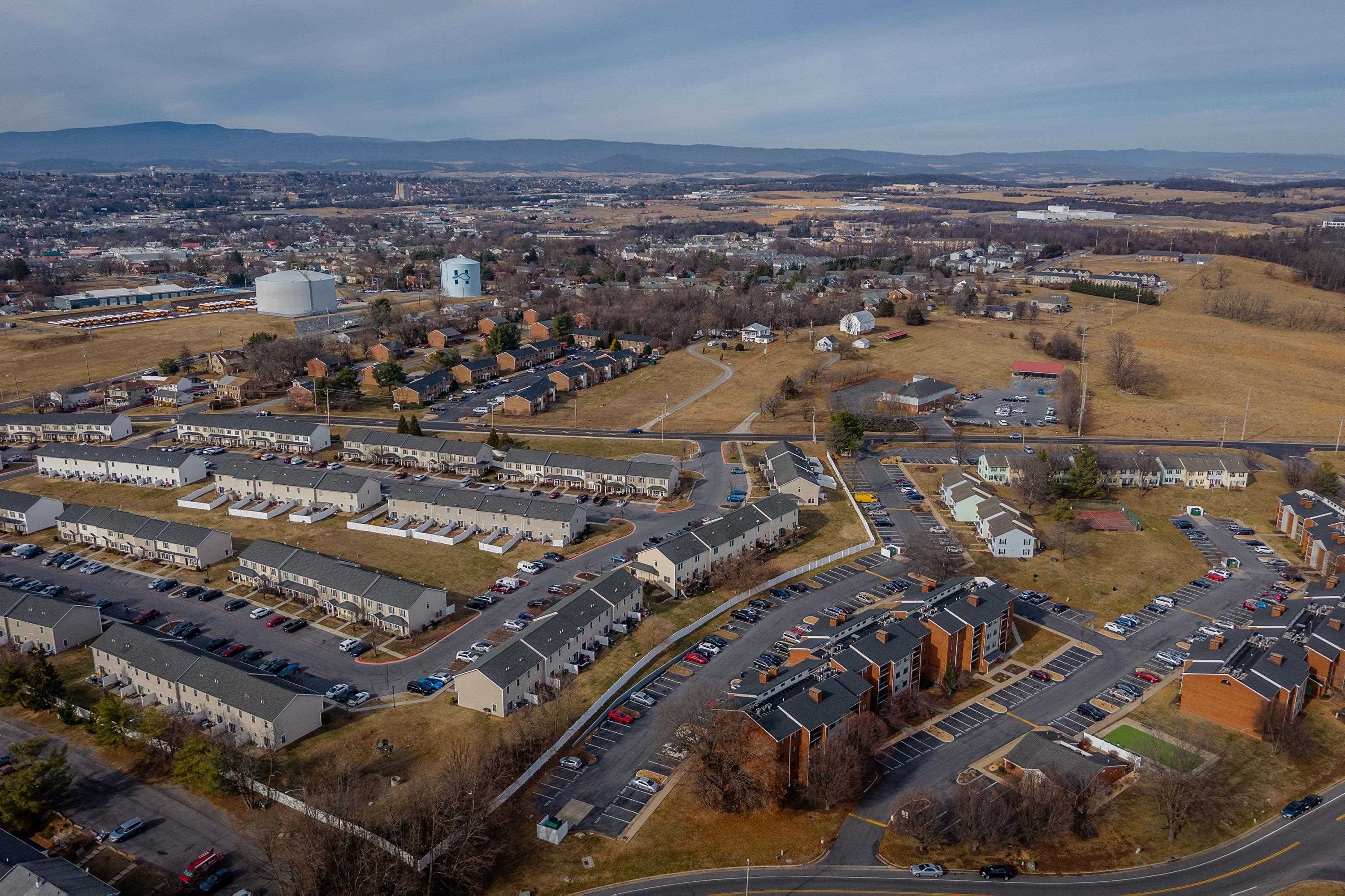 1211 Old Furnace Road Harrisonburg, VA 22802 - Photo 40 of 55 The aerial photo highlights the townhouse location within the Madison Manor neighborhood, the abundance of parking spaces, and the convenient location within the city of Harrisonburg.