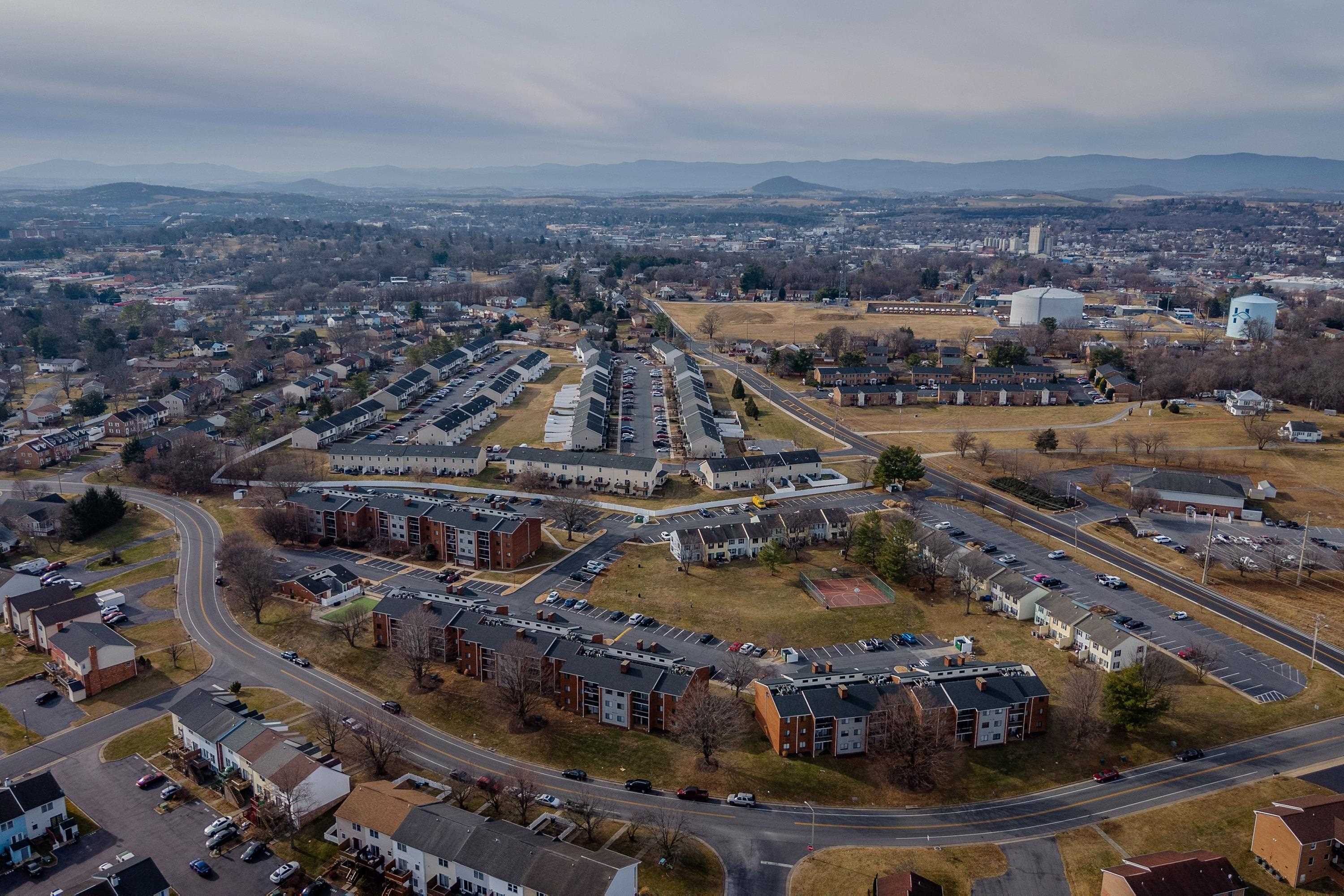 1211 Old Furnace Road Harrisonburg, VA 22802 - Photo 42 of 55 The aerial photo highlights the townhouse location within the Madison Manor neighborhood, the abundance of parking spaces, and the convenient location within the city of Harrisonburg.