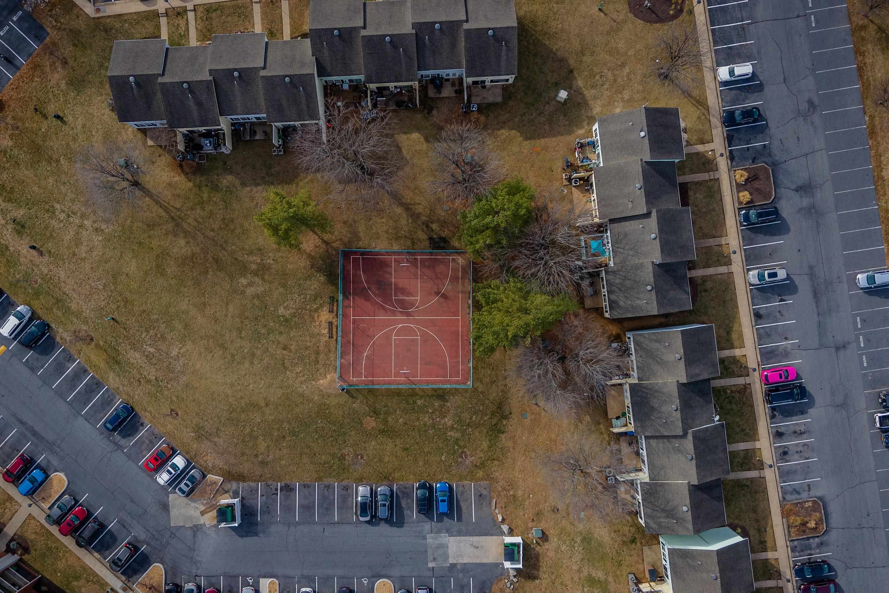 1211 Old Furnace Road Harrisonburg, VA 22802 - Photo 44 of 55 The aerial photo highlights the townhouse location within the Madison Manor neighborhood, the abundance of parking spaces, and the convenient location within the city of Harrisonburg.