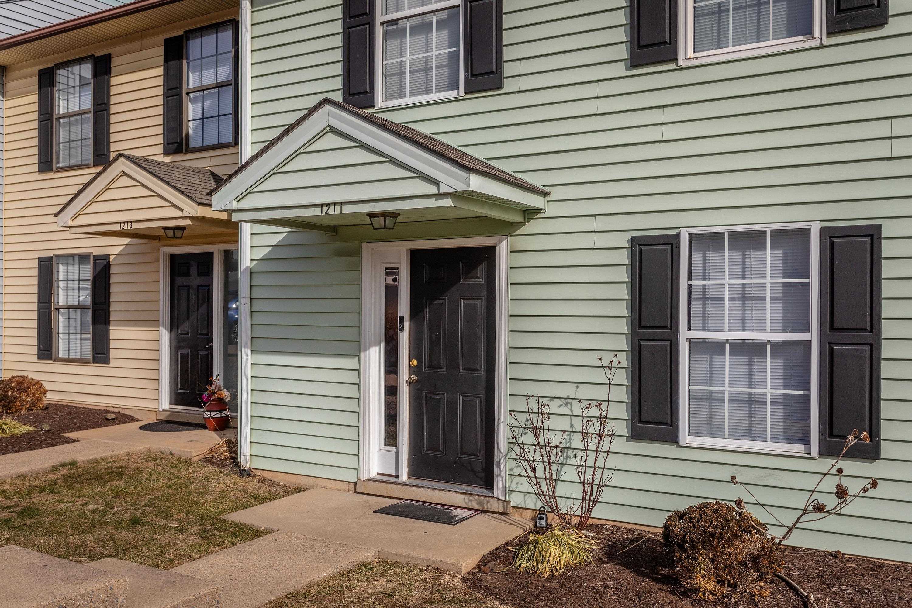1211 Old Furnace Road Harrisonburg, VA 22802 - Photo 47 of 55 The front view of the townhouse highlights the sidewalks, multiple parking spaces, covered front porch space, and landscaping.