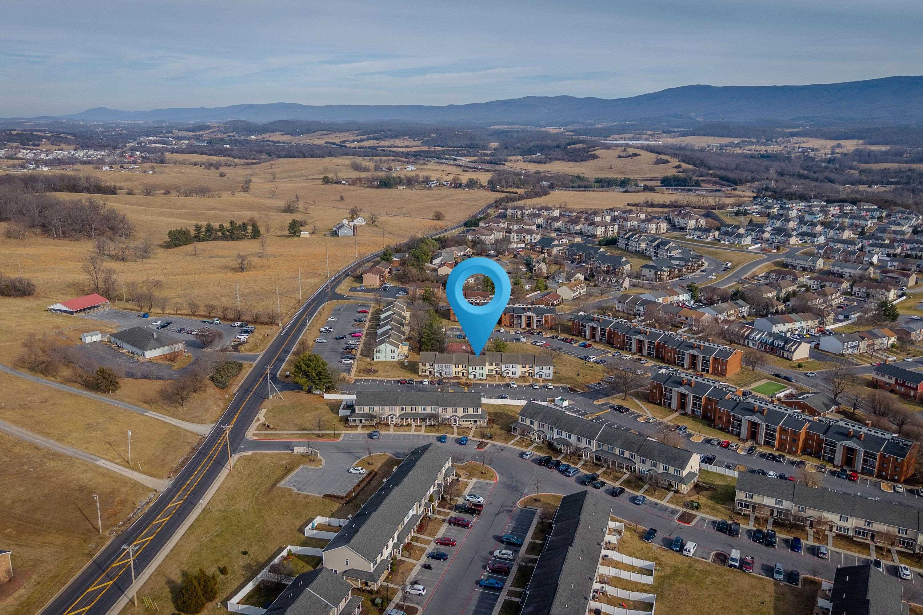 1211 Old Furnace Road Harrisonburg, VA 22802 - Photo 52 of 55 The aerial photo highlights the townhouse location within the Madison Manor neighborhood, the abundance of parking spaces, and the convenient location within the city of Harrisonburg.