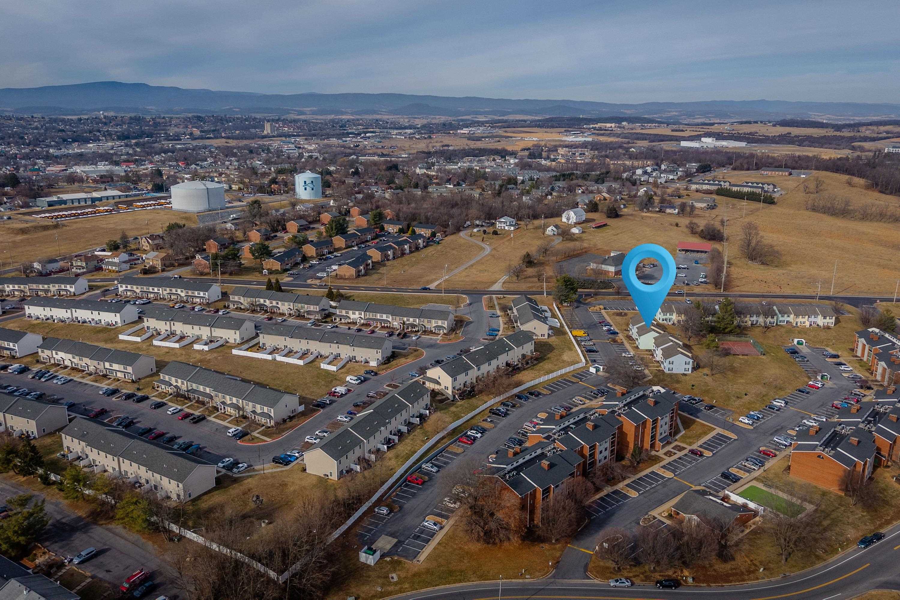 1211 Old Furnace Road Harrisonburg, VA 22802 - Photo 53 of 55 The aerial photo highlights the townhouse location within the Madison Manor neighborhood, the abundance of parking spaces, and the convenient location within the city of Harrisonburg.