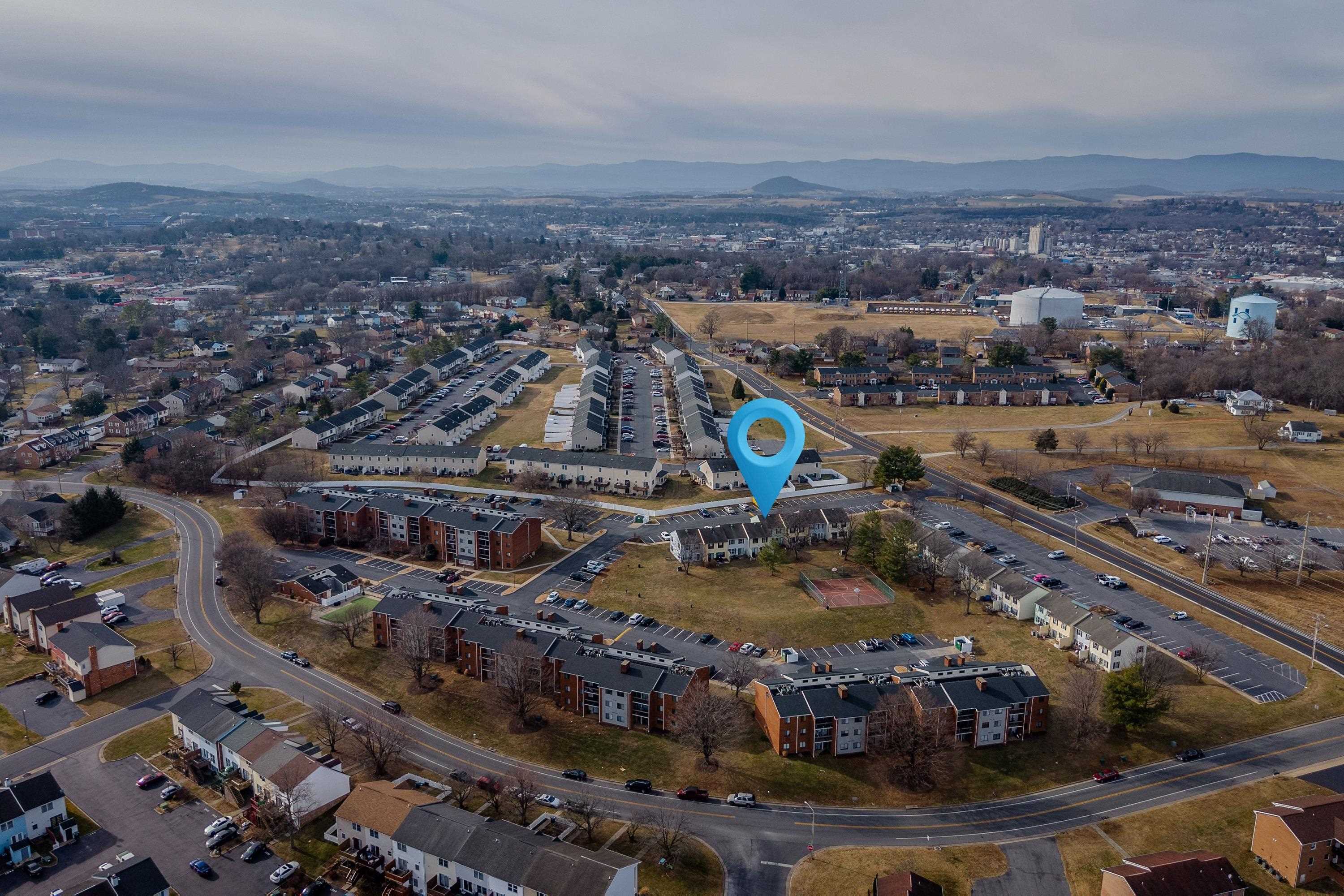 1211 Old Furnace Road Harrisonburg, VA 22802 - Photo 54 of 55 The aerial photo highlights the townhouse location within the Madison Manor neighborhood, the abundance of parking spaces, and the convenient location within the city of Harrisonburg.
