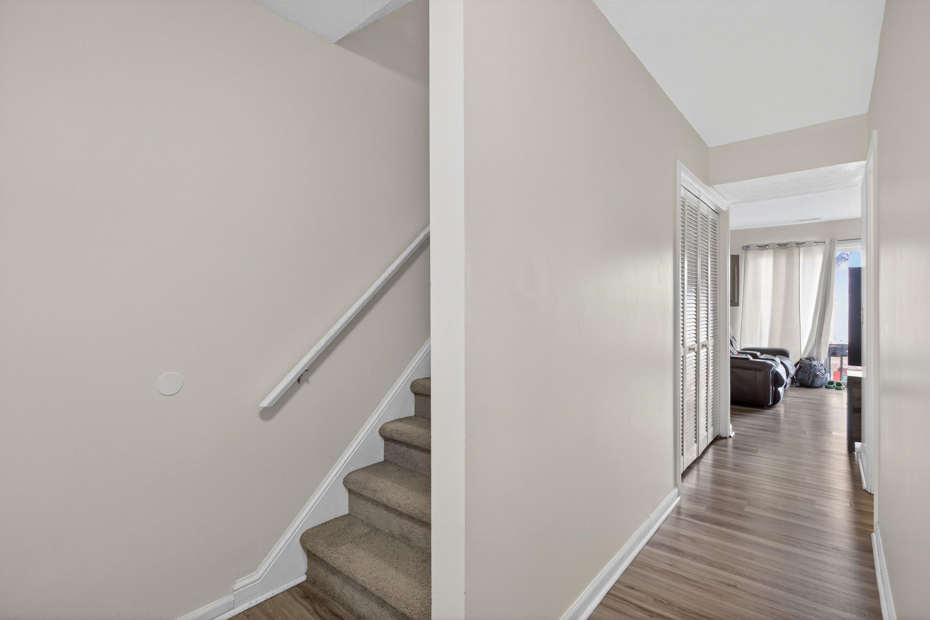 1211 Old Furnace Road Harrisonburg, VA 22802 - Photo 6 of 55 Upon entering the home you are greeted by a foyer space that opens up to the living room and the staircase leading to the upper level of the home.