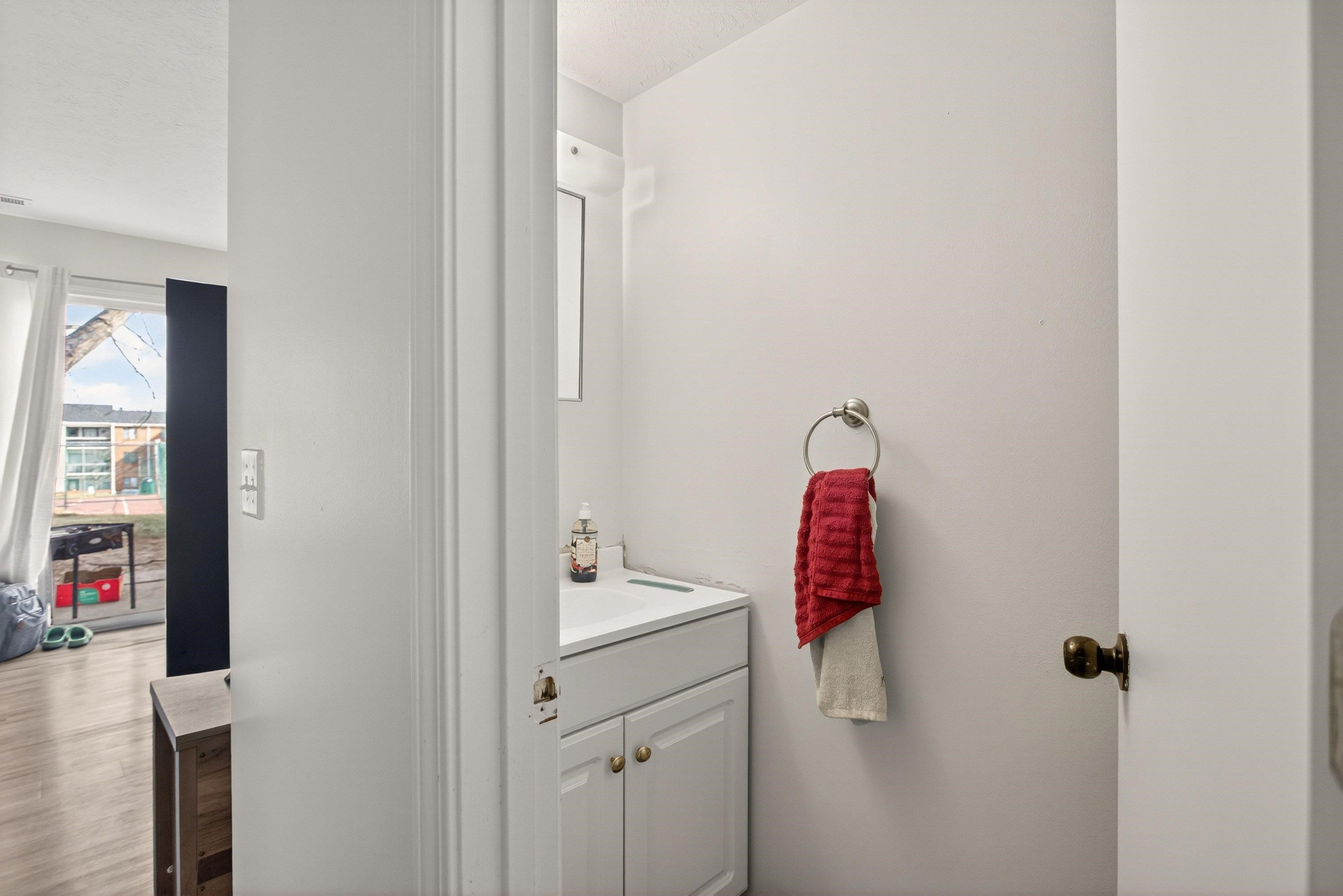 1211 Old Furnace Road Harrisonburg, VA 22802 - Photo 7 of 55 The powder bathroom offers convenience to the main level bedroom and living areas. This bathroom features a vanity with storage cabinetry.