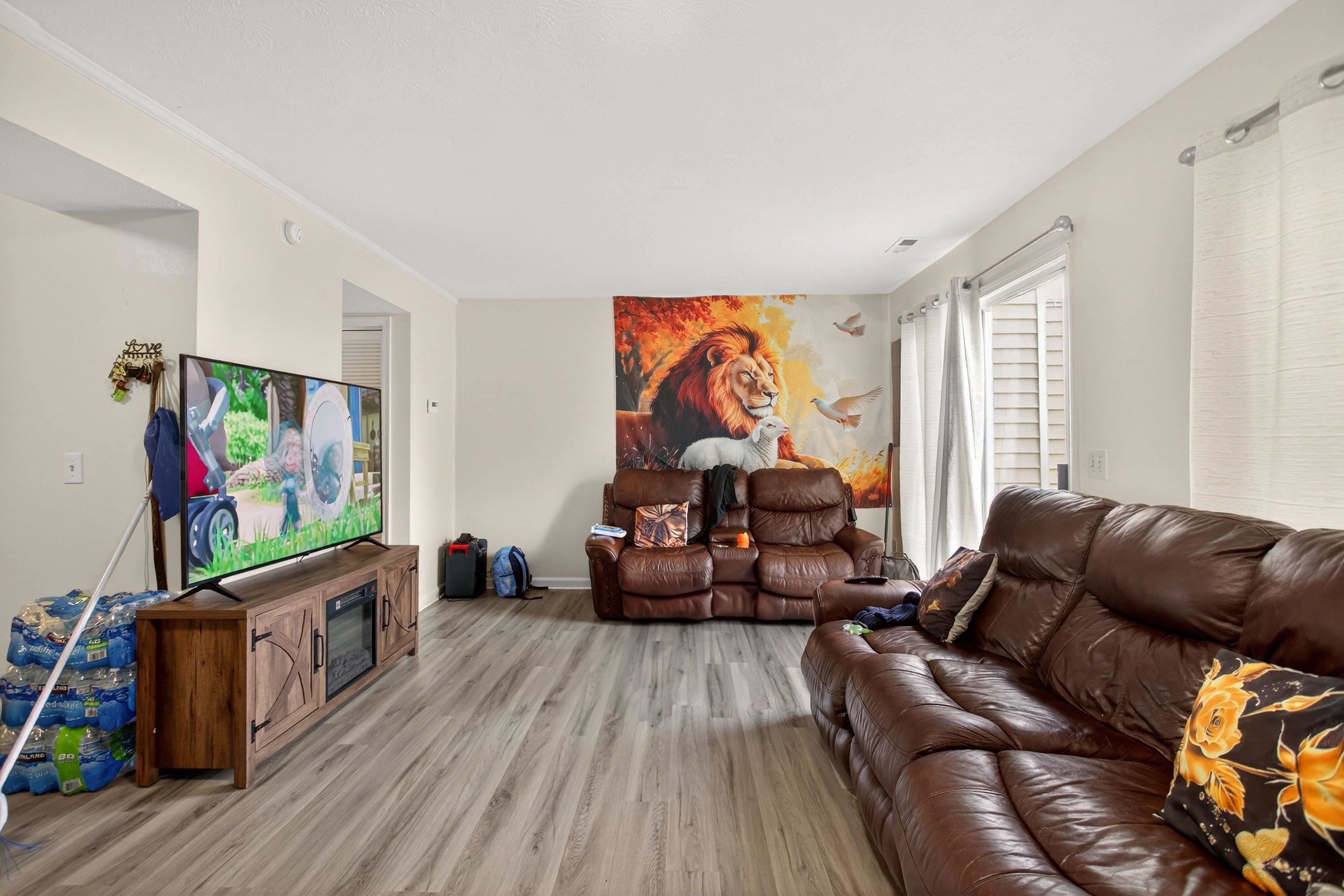 1211 Old Furnace Road Harrisonburg, VA 22802 - Photo 10 of 55 The very large living room offers an expansive area featuring luxury vinyl plank flooring and large patio doors leading to the rear of the home. This living room space opens up to the kitchen and dining area.