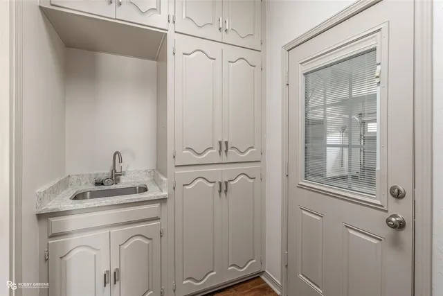 a bathroom with a sink a mirror and shower