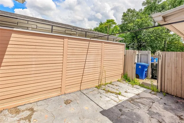 a front view of a house with basket ball court