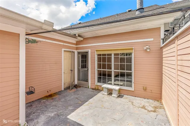 a front view of a house with a large window