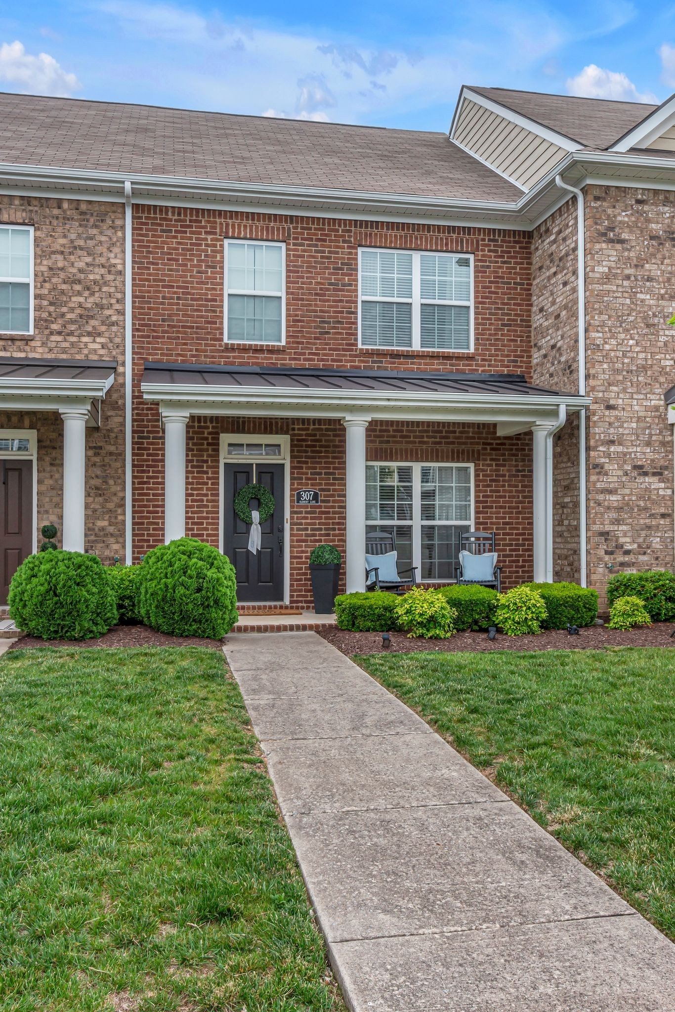 307 Oldbury Lane Spring Hill, TN 37174 - Photo 4 of 23 front view of a brick house with a yard