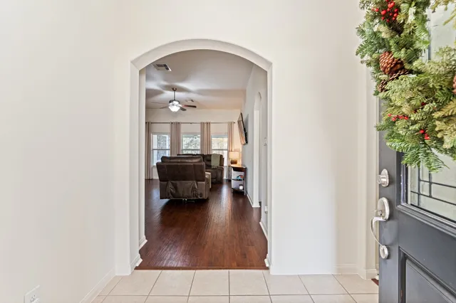 a view of living room with furniture and a potted plant
