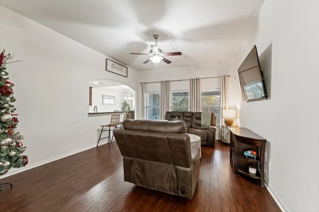 a living room with furniture and a flat screen tv