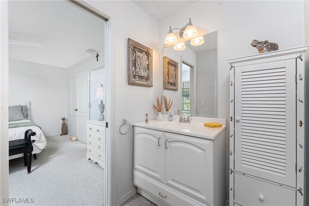 13100 South McCall Road, Unit 112 Port Charlotte, FL 33981 - Photo 18 of 45 a view of bathroom with dual sinks