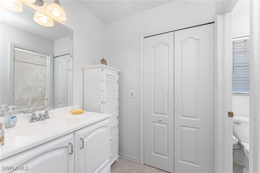 13100 South McCall Road, Unit 112 Port Charlotte, FL 33981 - Photo 19 of 45 a bathroom with a sink and a mirror