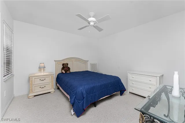 a bedroom with a bed and a cabinets