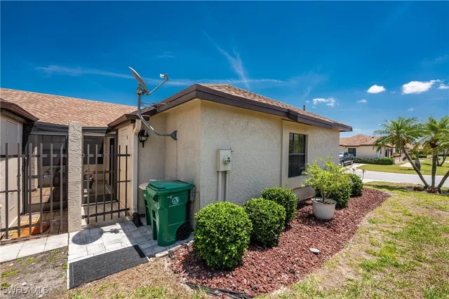 a view of a patio with a table and chairs