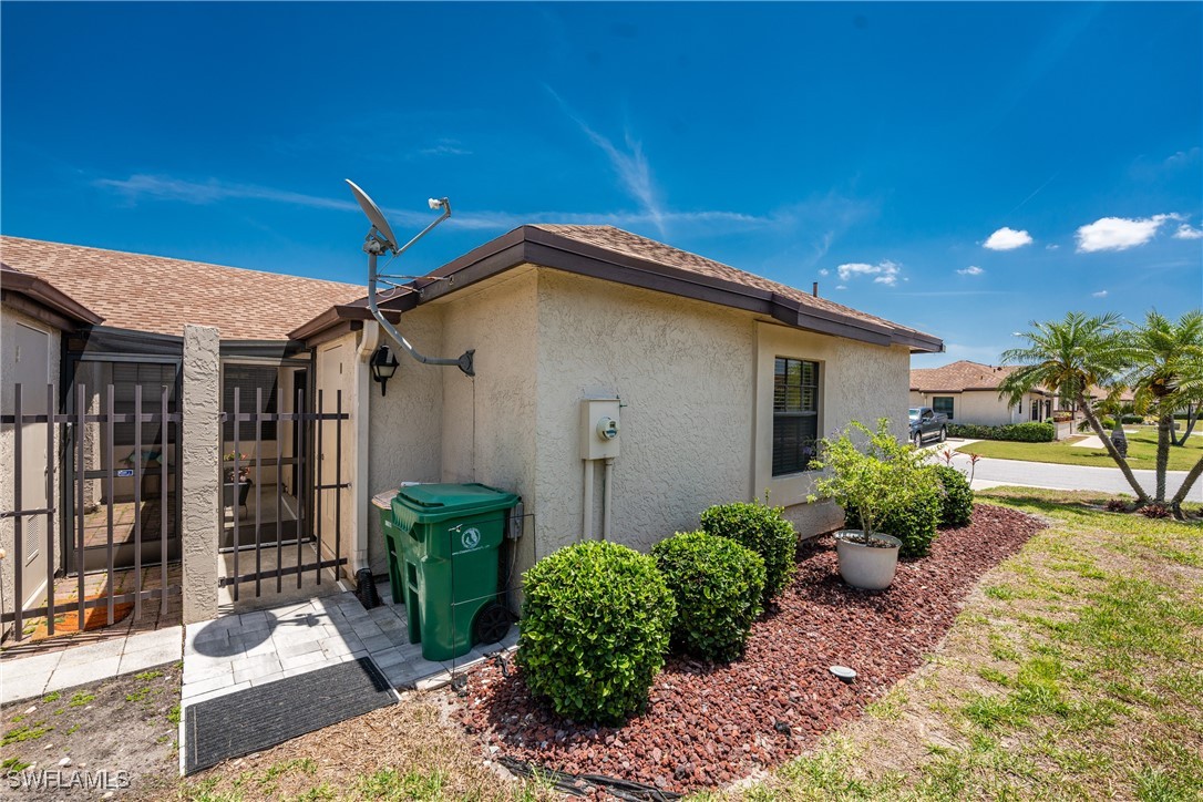 13100 South McCall Road, Unit 112 Port Charlotte, FL 33981 - Photo 26 of 45 a front view of a house with garden