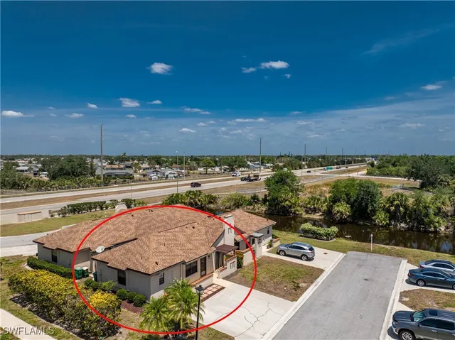 an aerial view of residential houses with outdoor space