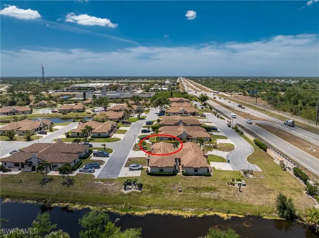 an aerial view of residential houses with outdoor space