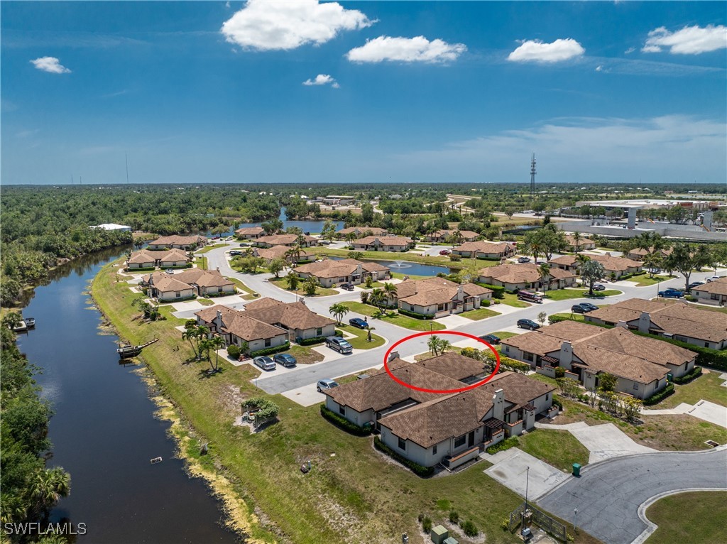 13100 South McCall Road, Unit 112 Port Charlotte, FL 33981 - Photo 36 of 45 an aerial view of residential houses with outdoor space